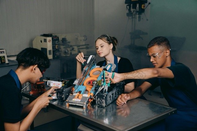 people sitting at the table doing apprenticeship programme